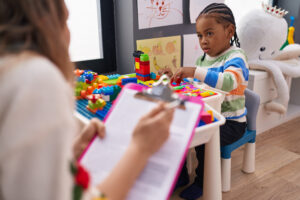 A person teaching a kid